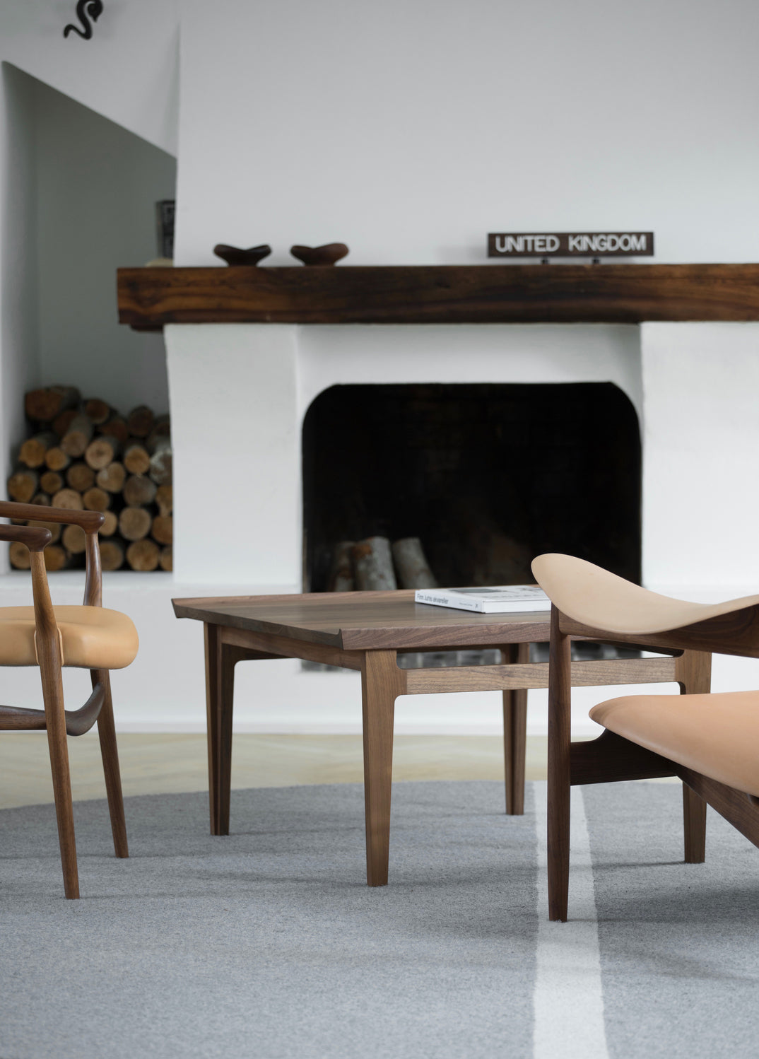 500 Coffee Table lifestyle view of the small table; original walnut design reference