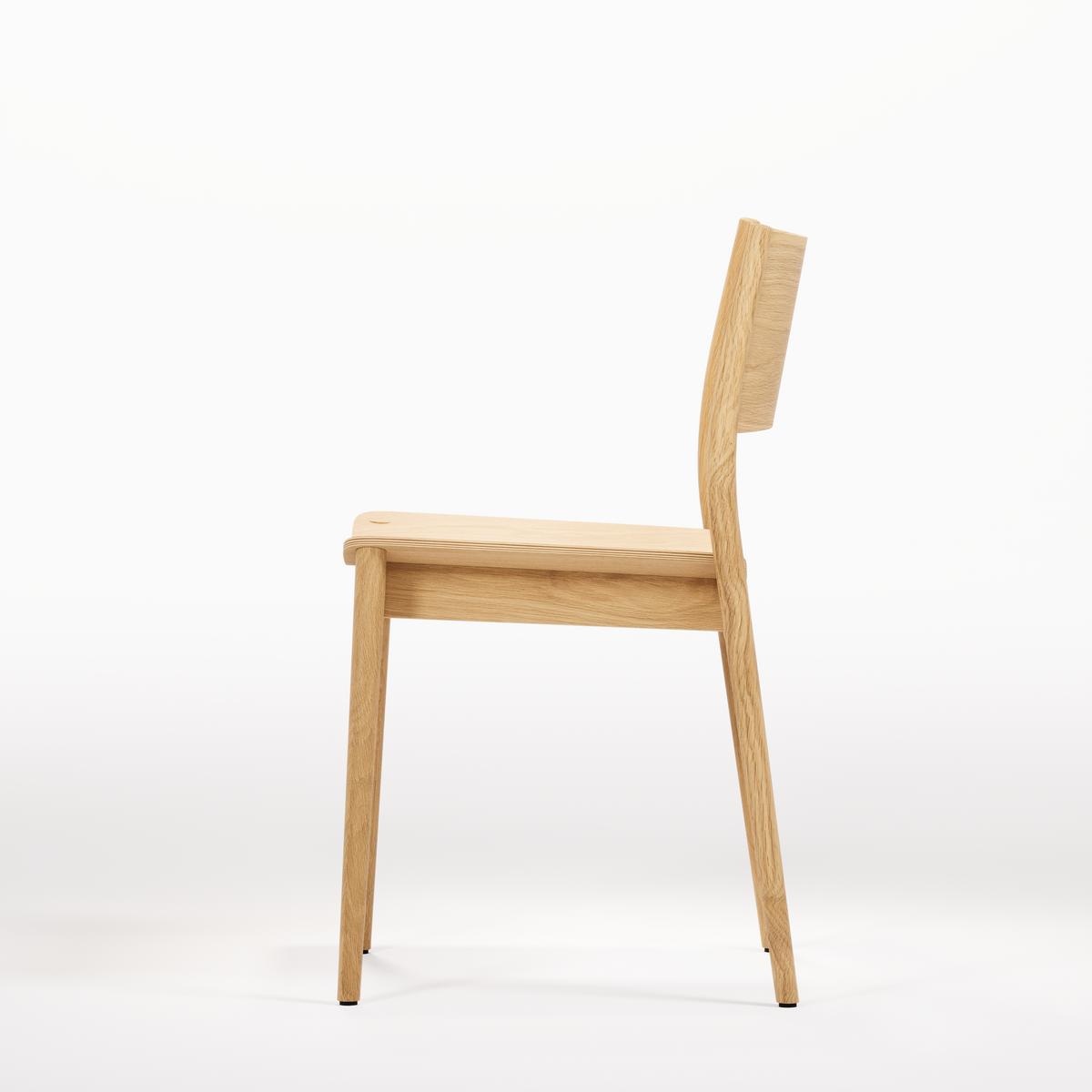 Vio Chair, side view in original oak finish; Wewood design reference, not Gulmohar teak photography