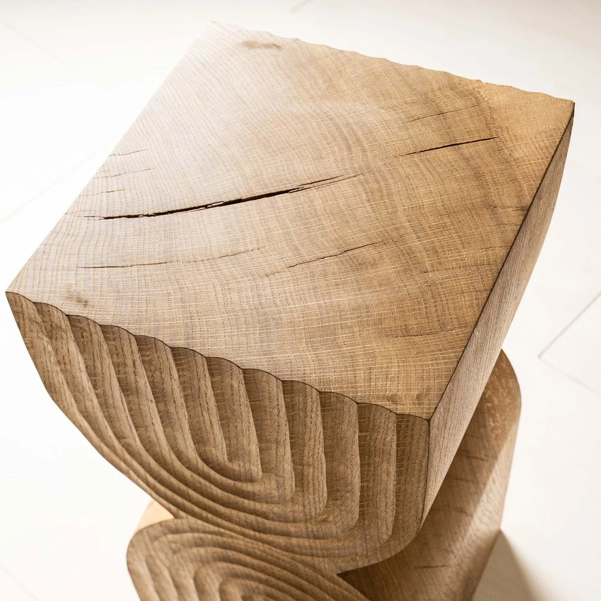 Aya Side Table by Mythology, detail view in reclaimed oak; design reference, not the finished Gulmohar teak version.