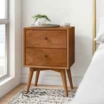 Teak wood nightstand with two drawers and tapered legs.