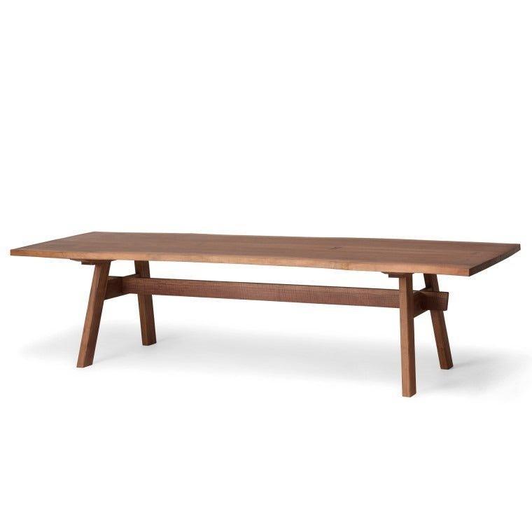Wooden dining table with trestle-style legs, shown as a catalogue design illustration
