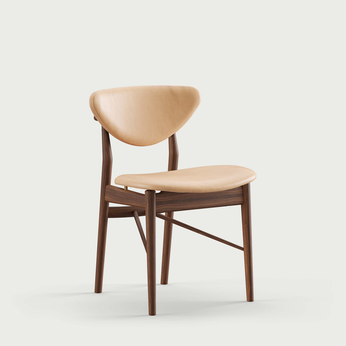 108 Dining Chair three-quarter view with natural leather upholstery; original walnut design reference