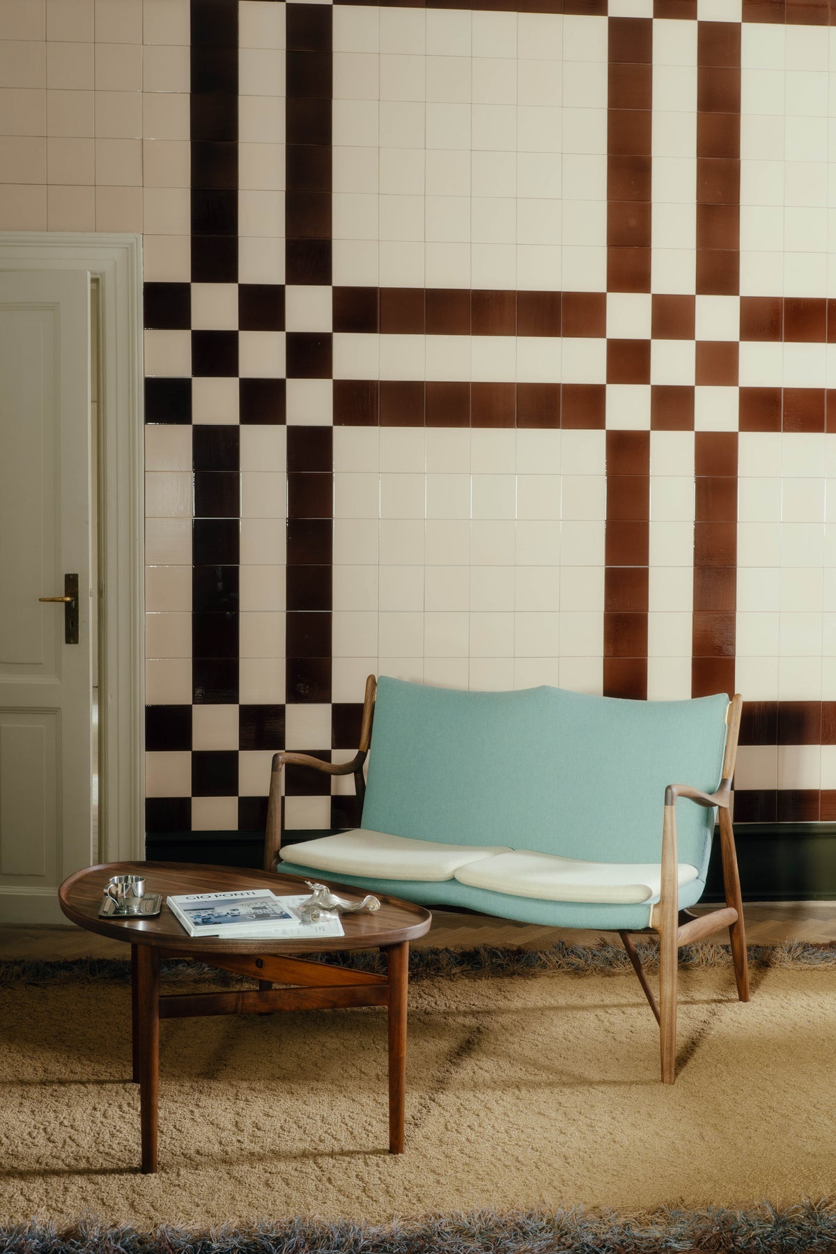 45 Sofa with pale two-tone fabric upholstery in a room, original walnut design reference
