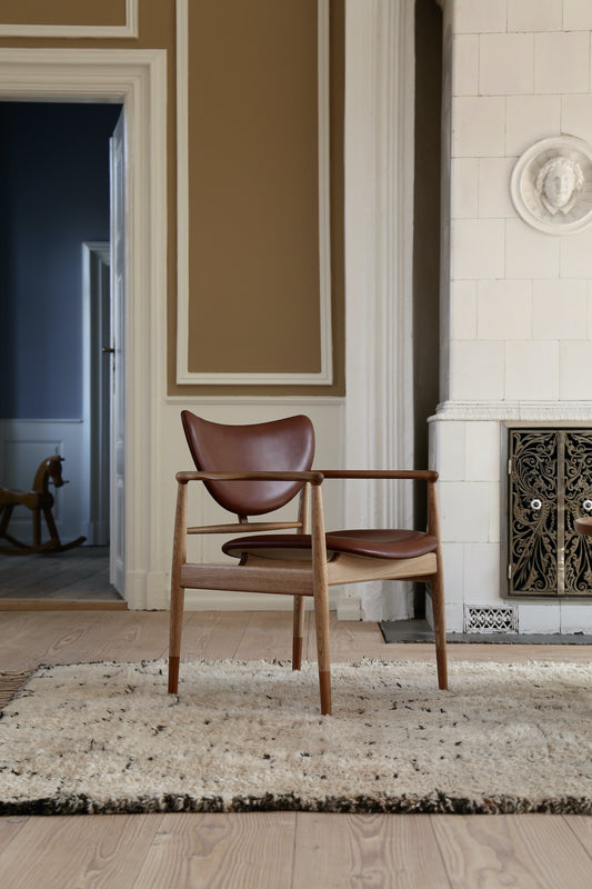 48 Lounge Chair three-quarter room view; original oak and walnut design reference