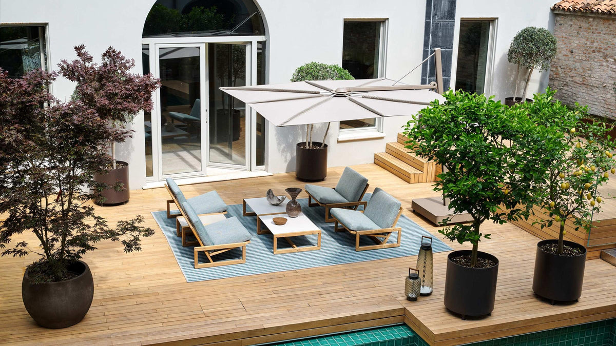 Carlotta original design reference — covered outdoor setting; not a photograph of Gulmohar's custom teak version.