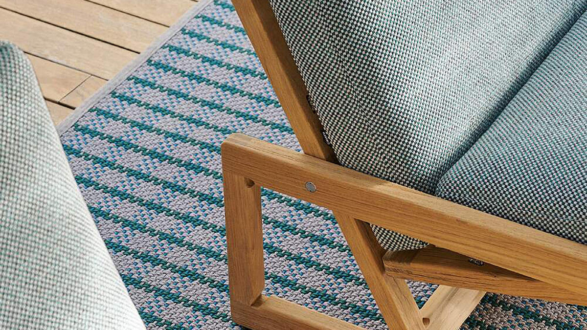 Carlotta original design reference — frame and cushion detail; not a photograph of Gulmohar's custom teak version.