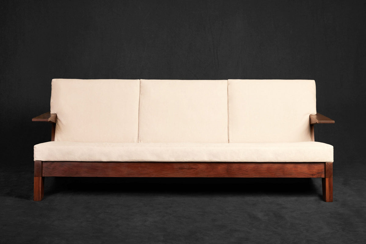 CJ1 Sofa front view with pale upholstery; original reclaimed peroba rosa design reference