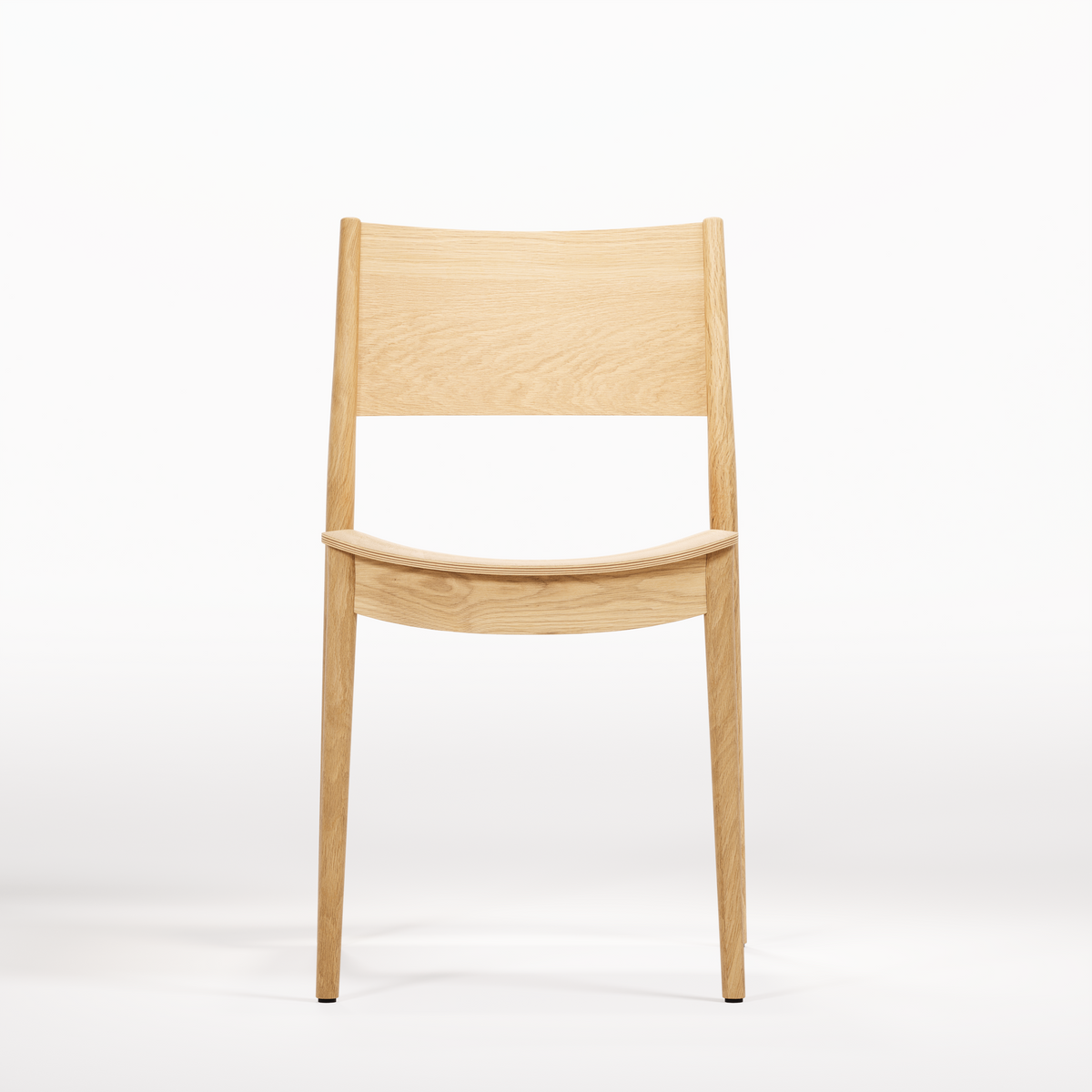Vio Chair, front view in original oak finish; Wewood design reference, not Gulmohar teak photography