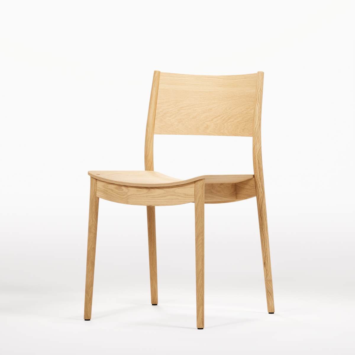 Vio Chair, three-quarter view in original oak finish; Wewood design reference, not Gulmohar teak photography