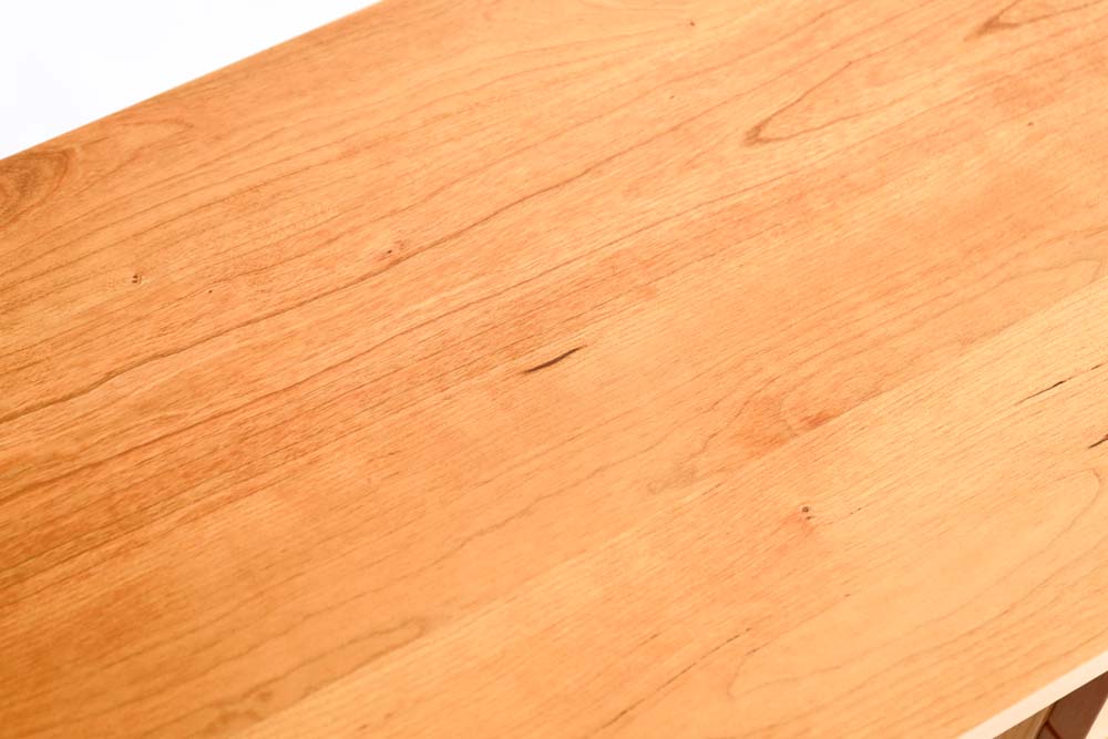 Noon Desk: Tabletop detail; original design reference, not Gulmohar teak finish