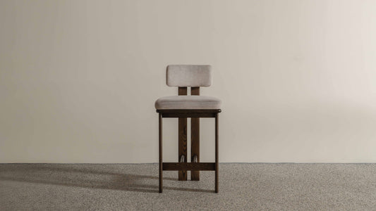 Eum Bar Chair original Eastern Edition reference — front view; original timber and upholstery, not a Gulmohar-made teak chair.