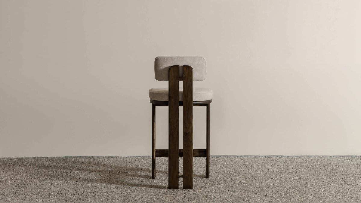Eum Bar Chair original Eastern Edition reference — rear view; original timber and upholstery, not a Gulmohar-made teak chair.
