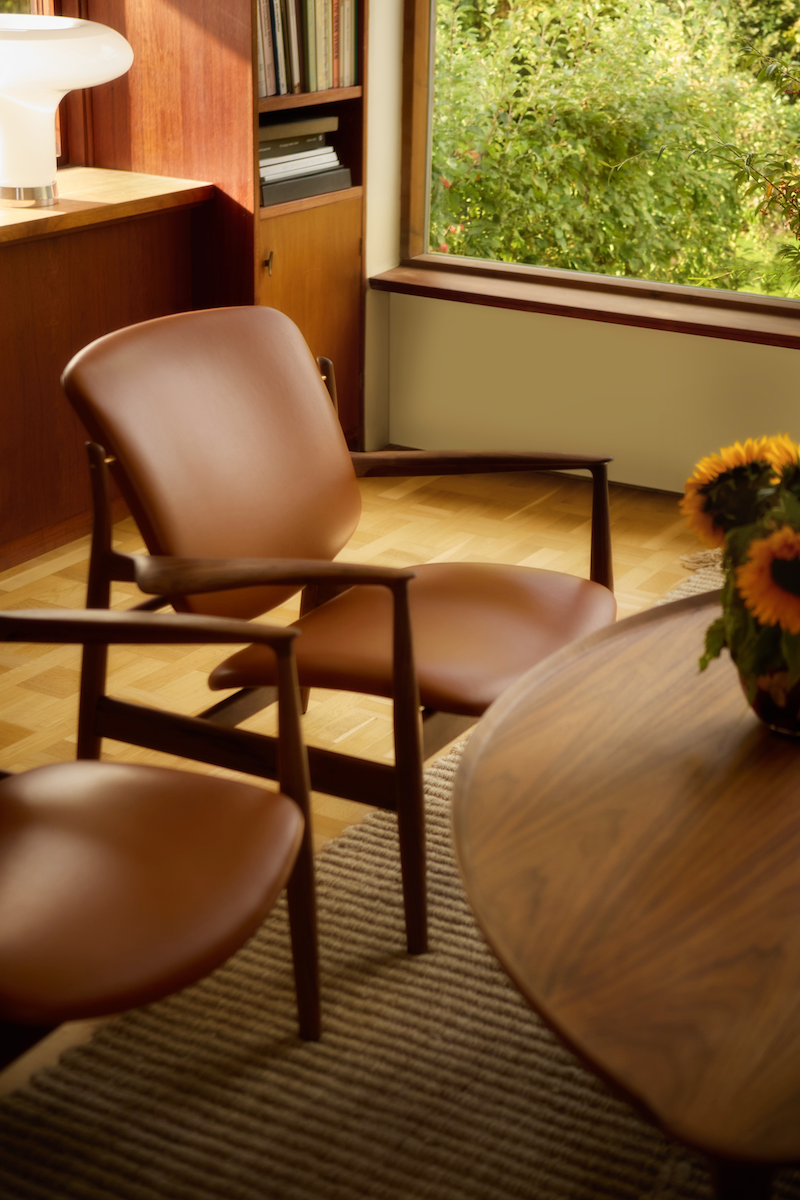 France Lounge Chair closer view of the leather seat and back; original walnut design reference