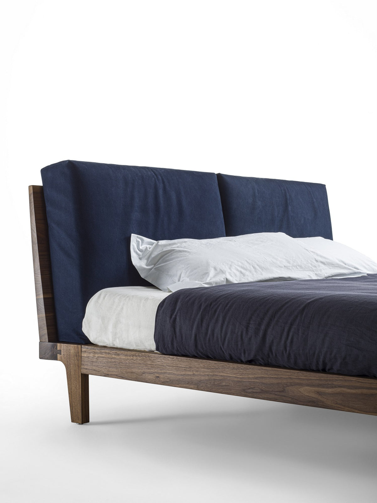 Revo Bed Soft style bed, view 2; design reference for a custom teak bed by Gulmohar Wood Works, Bangalore. Fabric shown is not final.