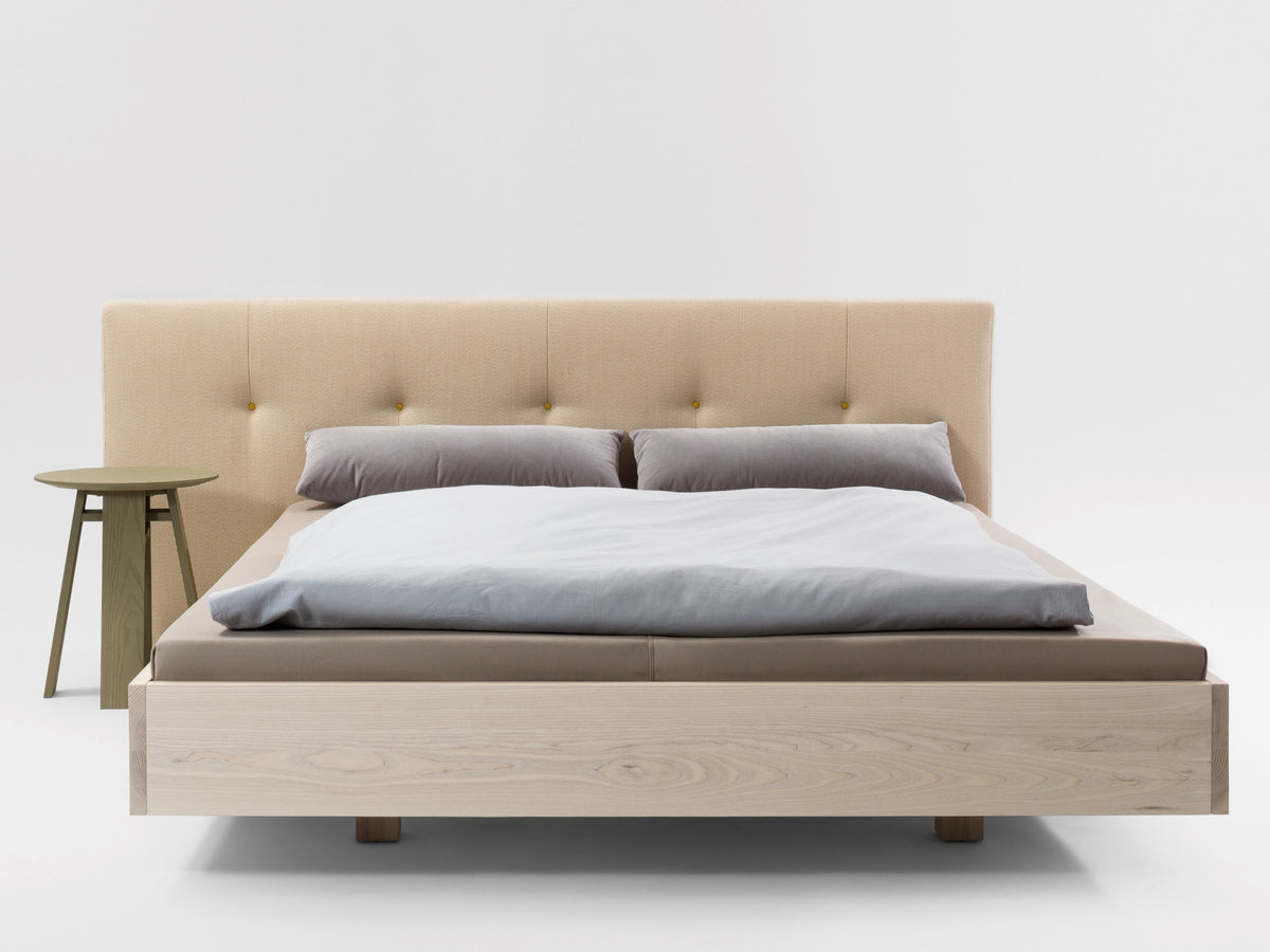 Simple Button style bed, view 1; design reference for a custom teak bed by Gulmohar Wood Works, Bangalore. Fabric shown is not final.