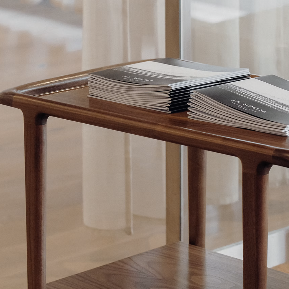 Original J.L. Møller Model 44 design reference — shelf and frame detail. Source: BLU KAT. Custom Gulmohar teak version may differ.