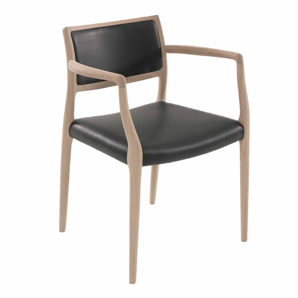 Original J.L. Møller Model 65 design reference — front three-quarter view. Source: Hansen Interiors. Custom Gulmohar teak version may differ.