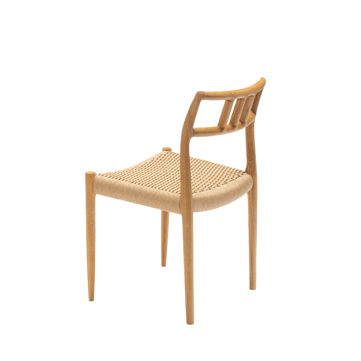 Original J.L. Møller Model 79 design reference — rear three-quarter view. Source: J.L. Møller. Custom Gulmohar teak version may differ.
