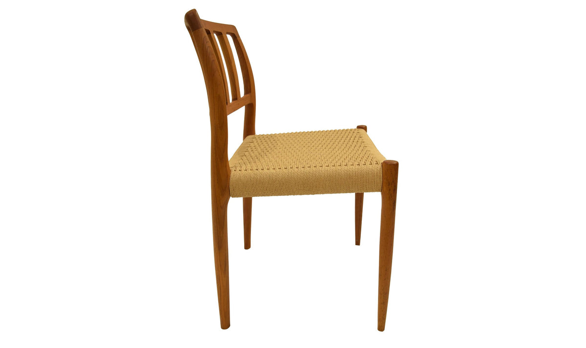 Original J.L. Møller Model 83 design reference — side view. Source: Hansen Interiors. Custom Gulmohar teak version may differ.
