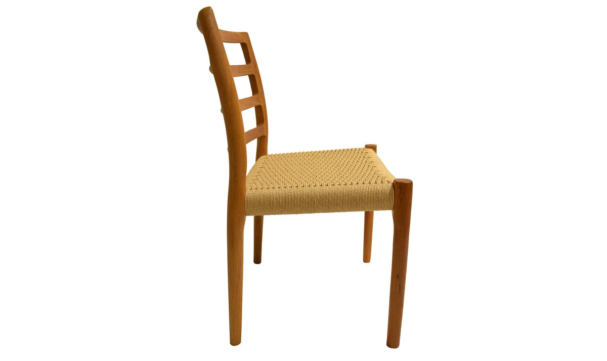 Original J.L. Møller Model 85 design reference — side view. Source: Hansen Interiors. Custom Gulmohar teak version may differ.