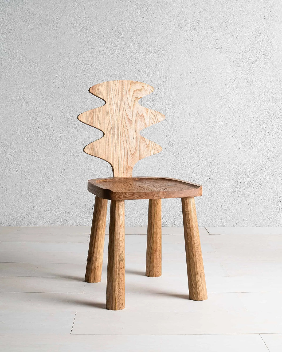 Enki Chair by Mythology, overall view in British elm; design reference, not the finished Gulmohar teak version.