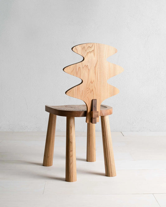 Enki Chair by Mythology, alternate view in British elm; design reference, not the finished Gulmohar teak version.