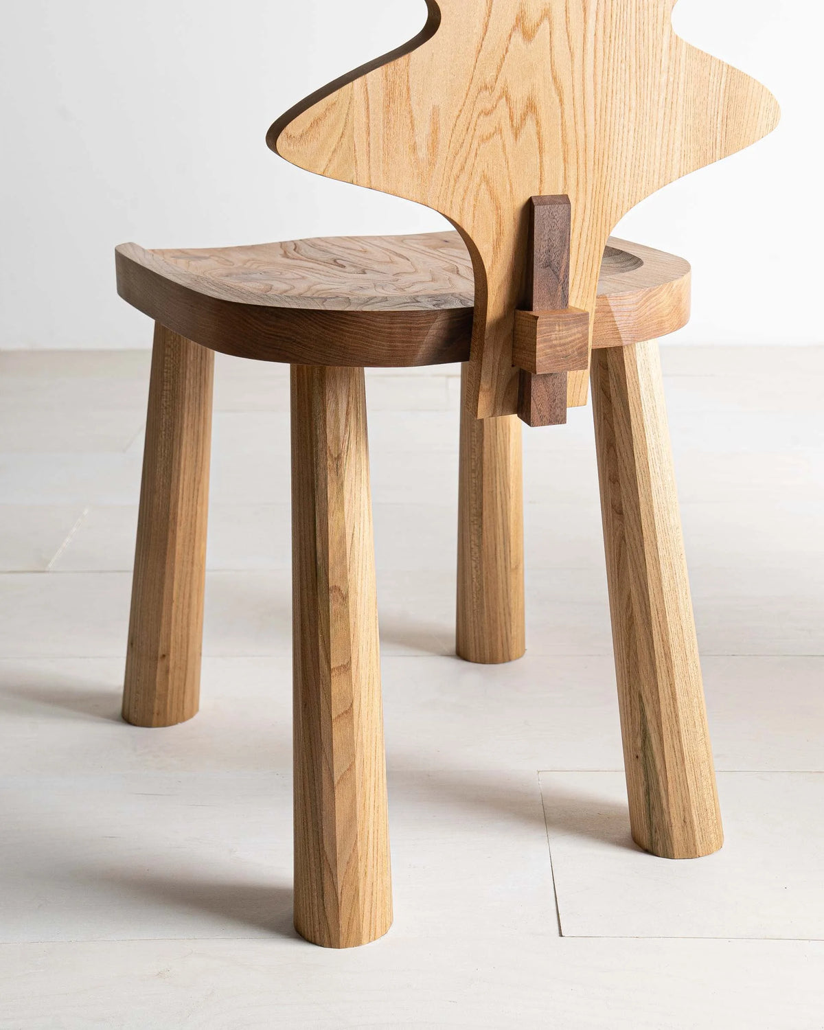 Enki Chair by Mythology, detail view in British elm; design reference, not the finished Gulmohar teak version.