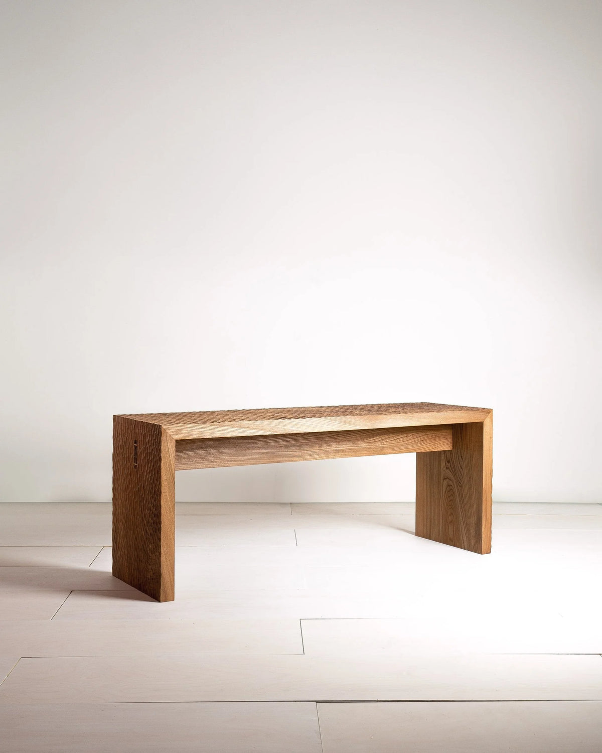Leto Bench by Mythology, overall view in British elm; design reference, not the finished Gulmohar teak version.