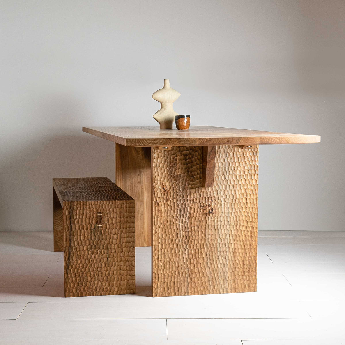 Leto Bench by Mythology, detail view in British elm; design reference, not the finished Gulmohar teak version.
