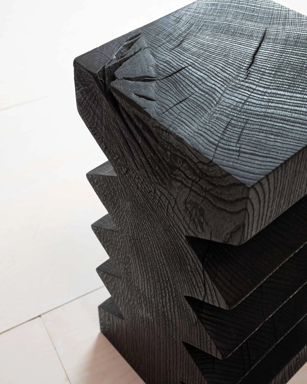 Vayu Side Table by Mythology, alternate view in scorched reclaimed timber; design reference, not the finished Gulmohar teak version.