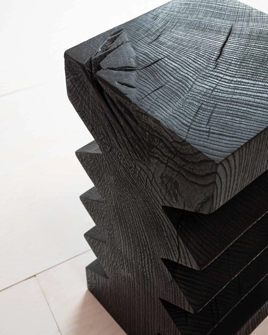 Vayu Side Table by Mythology, alternate view in scorched reclaimed timber; design reference, not the finished Gulmohar teak version.