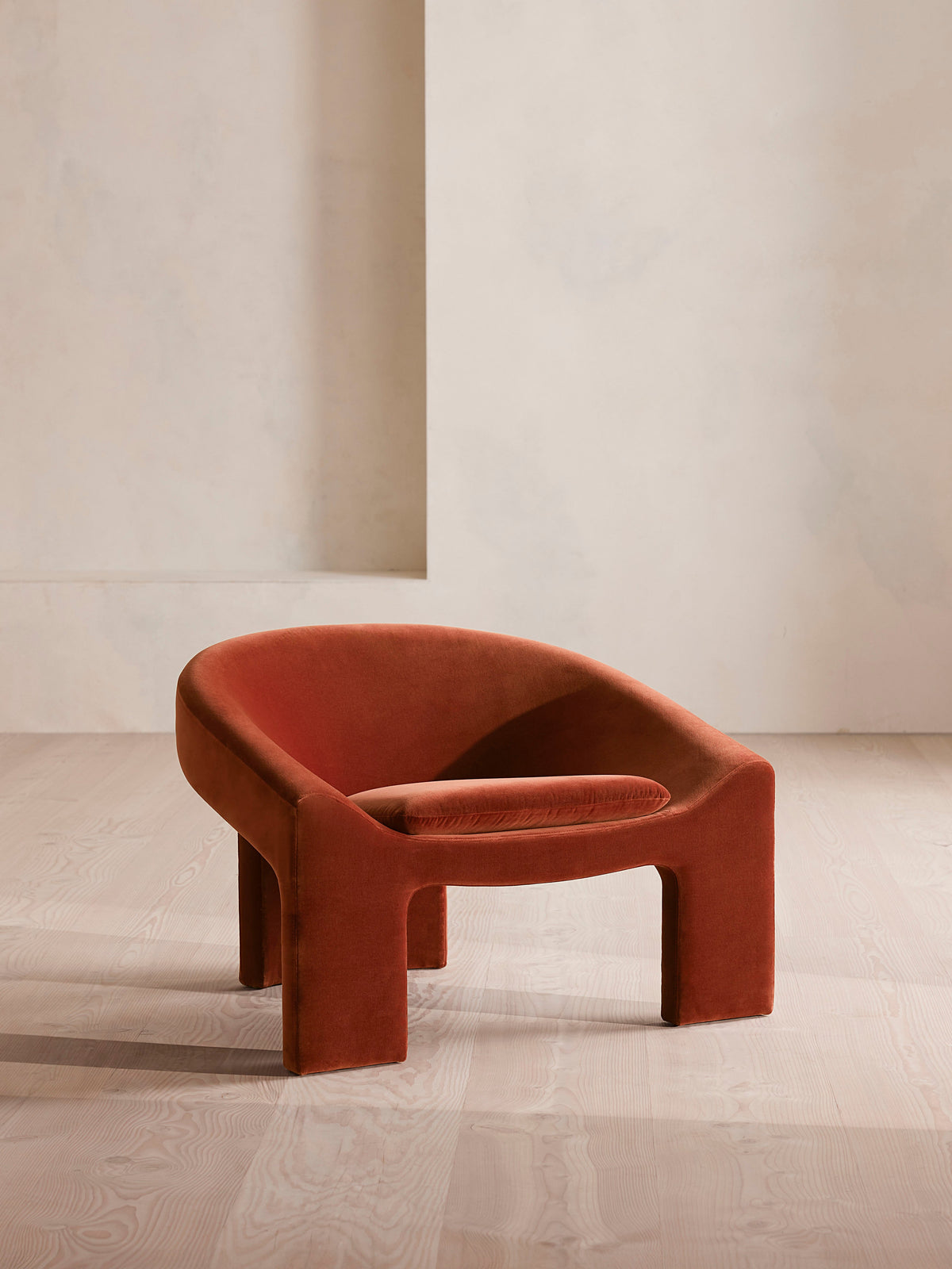 Soho Home Dafne Armchair, front three-quarter view. Original design reference; Gulmohar custom version uses teak.
