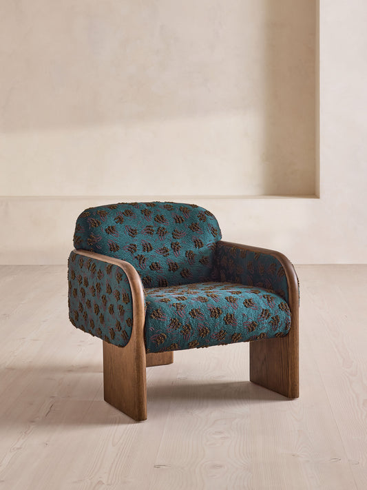 Soho Home Eddie Armchair, front three-quarter view. Original design reference; Gulmohar custom version uses teak.