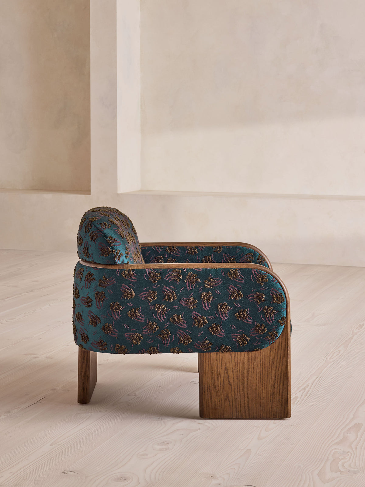 Soho Home Eddie Armchair, side view. Original design reference; Gulmohar custom version uses teak.