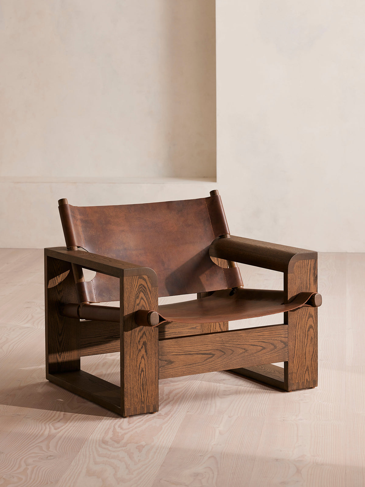 Soho Home Gabriel Leather Armchair, front three-quarter view. Original design reference; Gulmohar custom version uses teak.