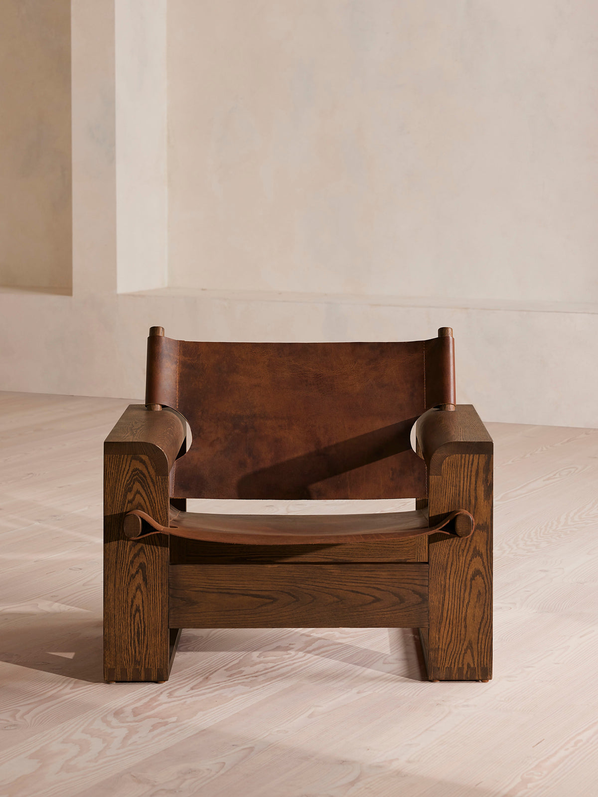 Soho Home Gabriel Leather Armchair, front view. Original design reference; Gulmohar custom version uses teak.