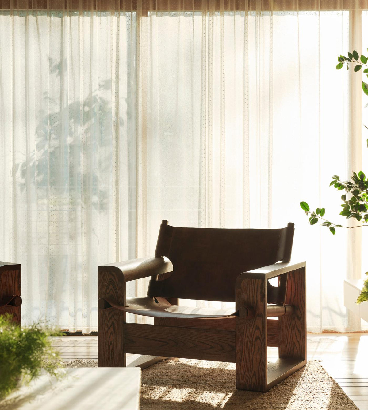 Soho Home Gabriel Leather Armchair, lifestyle view. Original design reference; Gulmohar custom version uses teak.