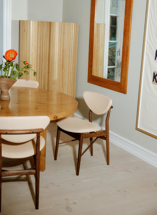 108 Dining Chair dining room view; original walnut design reference