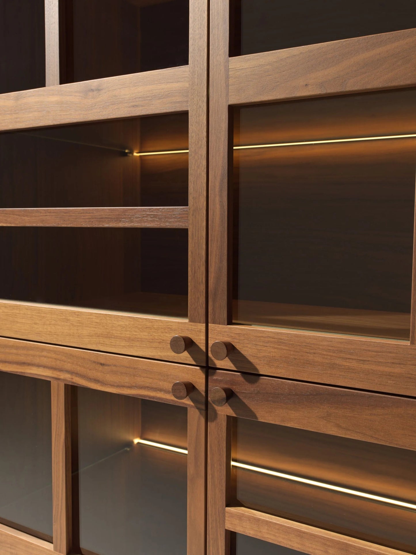 Torii teak wood display cabinet with bronzed glass doors and LED lighting.