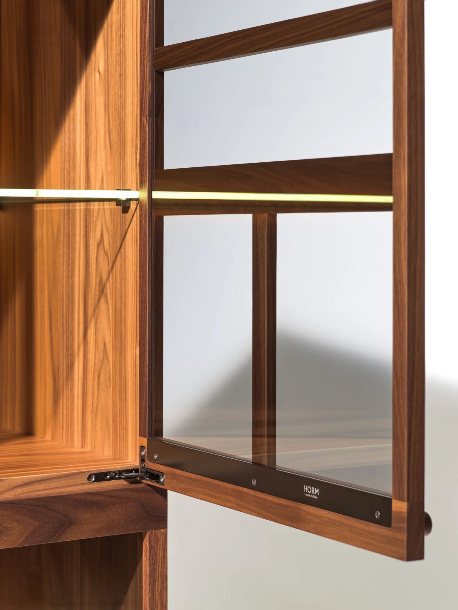 Torii teak wood display cabinet with LED lighting and bronzed glass doors.